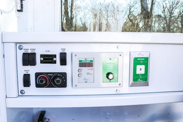 Oxygen system, lighting, and power controls in NEMT van