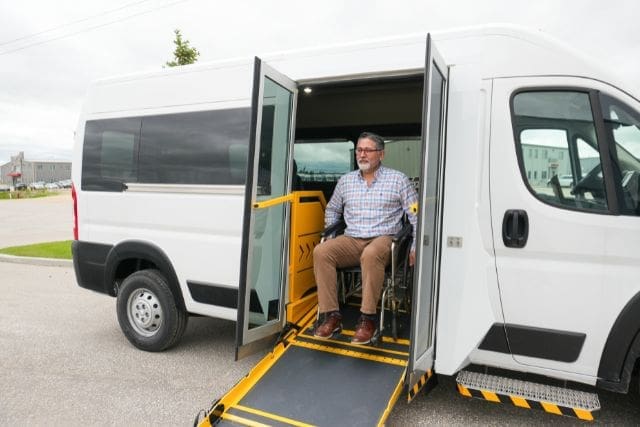 Wheelchair rolling out of wheelchair van.