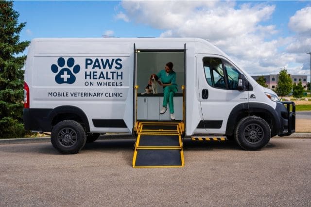 Veterinarian and Dog in a Mobile Vet Clinic